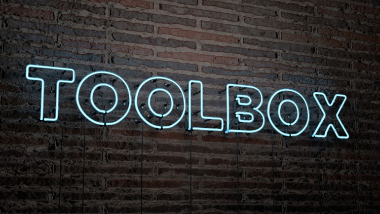 Toolbox Leuchtschrift auf Backsteinwand